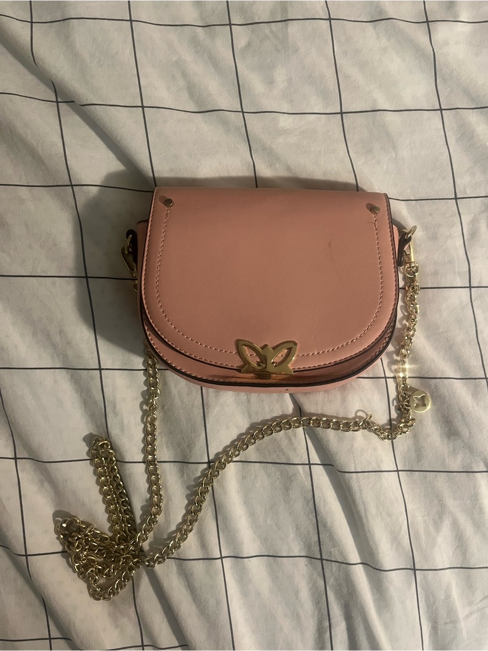 Compact Pink Crossbody Bag with Gold Chain and Butterfly Accent